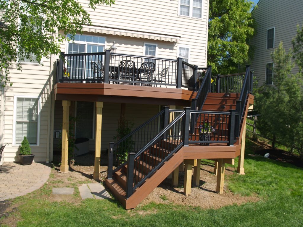 New Deck with stairs and black fences.