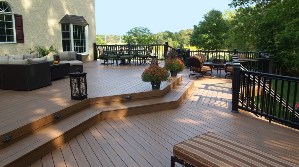 new deck with furniture and plants from McHenry Decks.