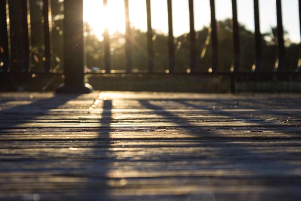Wooden Deck With Sun Shining Through