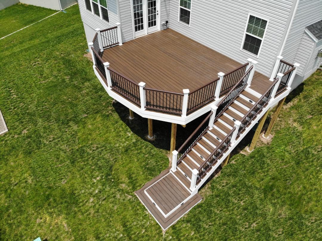 Fake curve deck with landing under stairs from McHenry Decks.